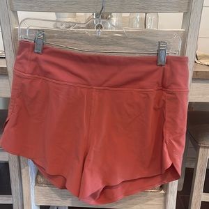 Athleta Run With It 3.5 inch athletic shorts- terra cotta color- size small